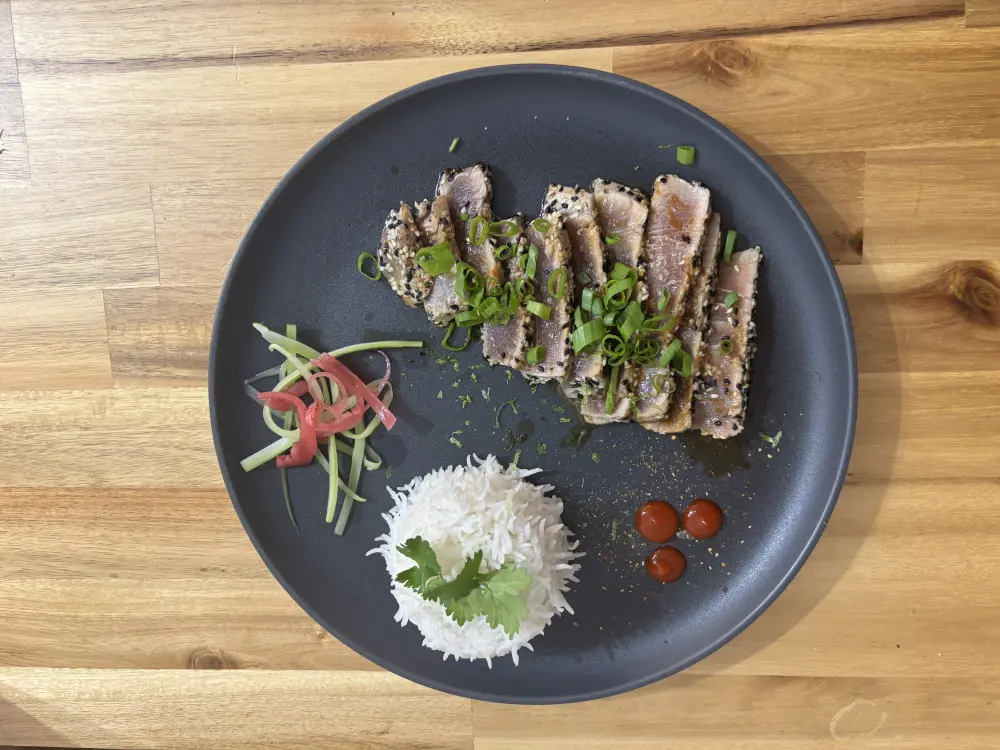Sesame-glazed tuna tataki with warm rice and crunchy celery