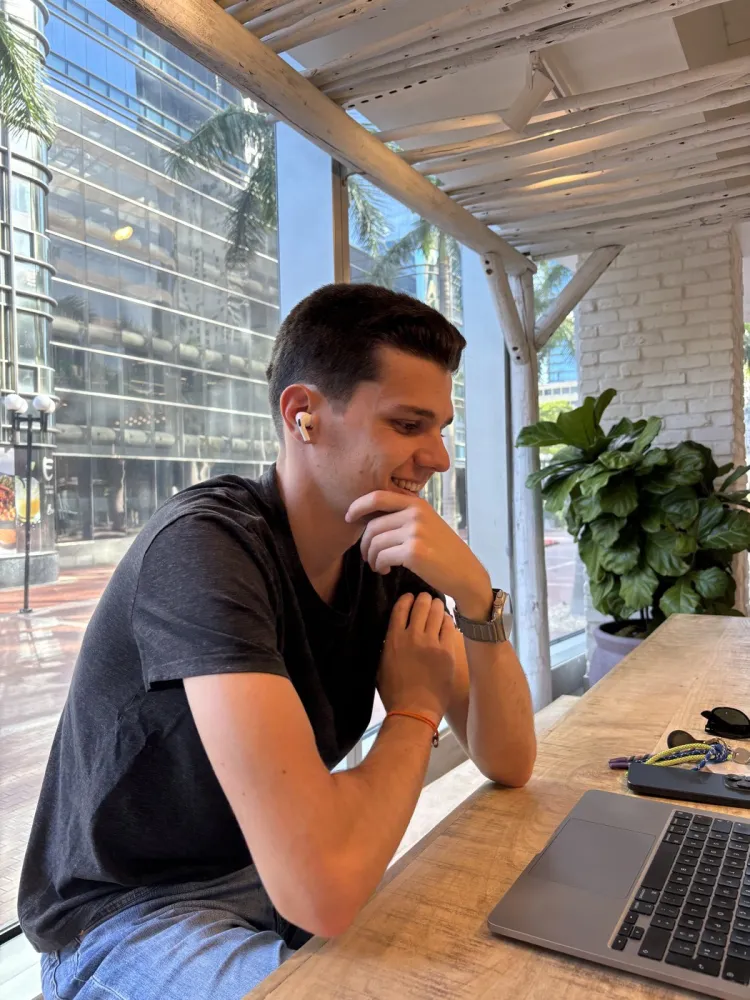 Portrait of Greg smiling at a café